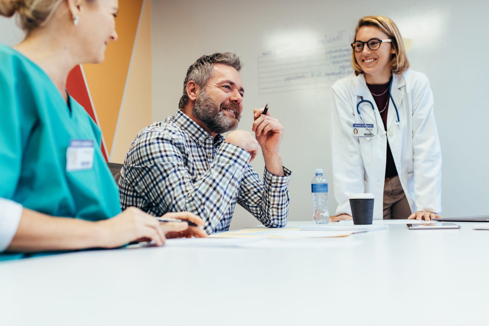 Group of medical professionals in a conference room having a meeting.