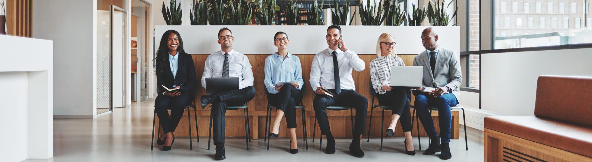 Group of business people waiting together in an office 